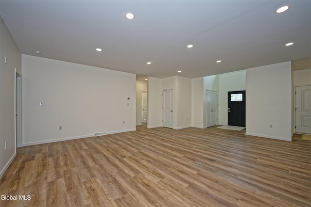 145C Bozenkill Rd, Altamont, NY 12009 - unfurnished living room with light wood-type flooring and recessed lighting