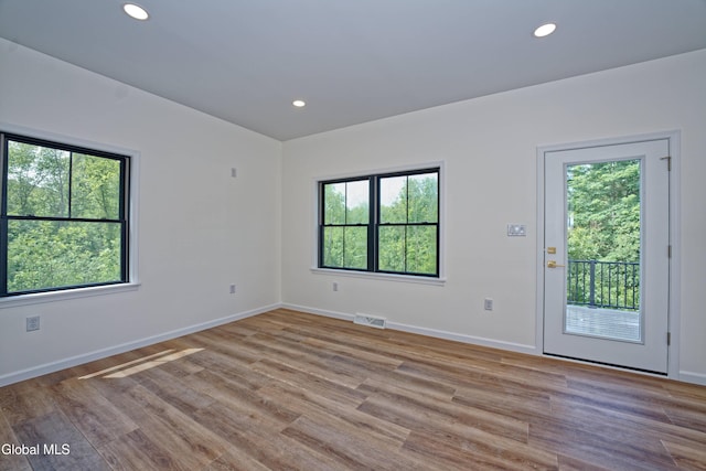 145C Bozenkill Rd, Altamont, NY 12009 - empty room with plenty of natural light, wood finished floors, and recessed lighting