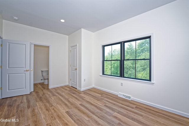 145C Bozenkill Rd, Altamont, NY 12009 - unfurnished bedroom featuring light wood-style flooring, multiple windows, and recessed lighting