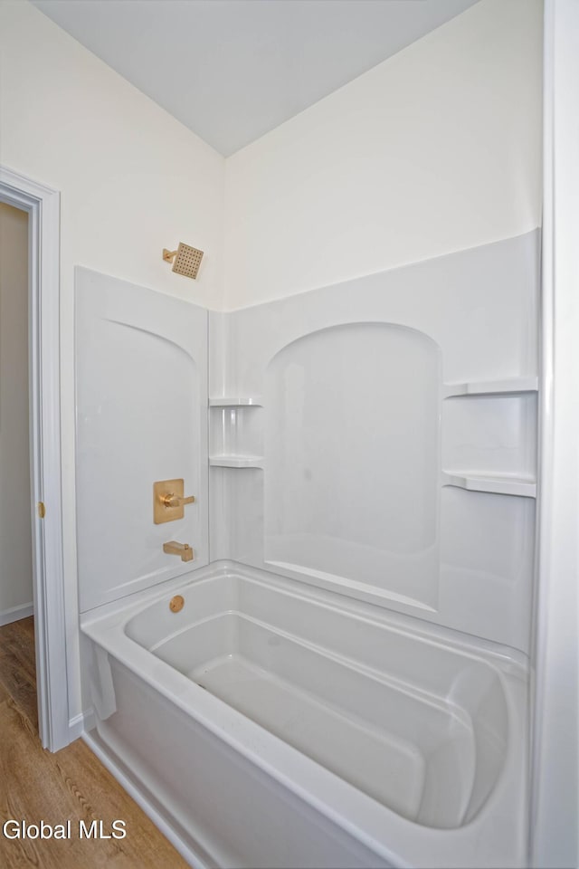 145C Bozenkill Rd, Altamont, NY 12009 - bathroom featuring wood finished floors and tub / shower combination