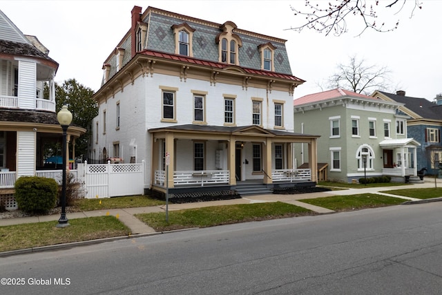 128 Circular St, Saratoga Springs, NY 12866 - second empire-style home with mansard roof, covered porch, and a high end roof