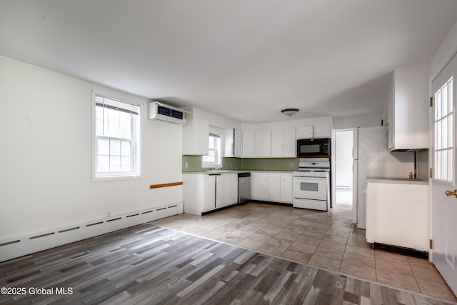 128 Circular St, Saratoga Springs, NY 12866 - kitchen featuring white stove, black microwave, stainless steel dishwasher, light wood finished floors, and white cabinetry