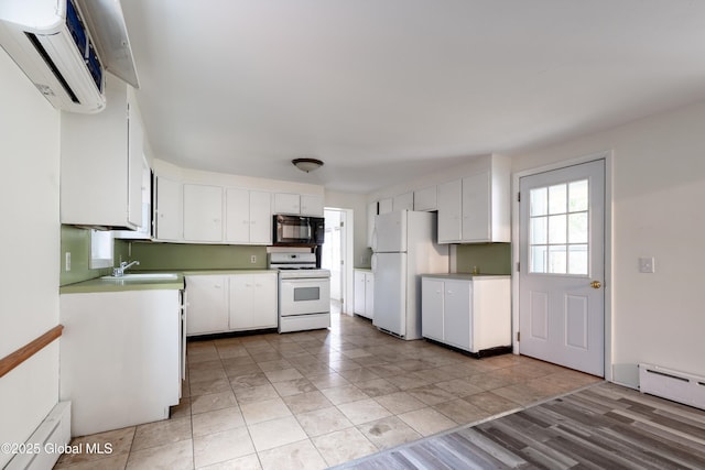 128 Circular St, Saratoga Springs, NY 12866 - kitchen featuring white appliances, a baseboard radiator, a wall unit AC, white cabinetry, and light countertops