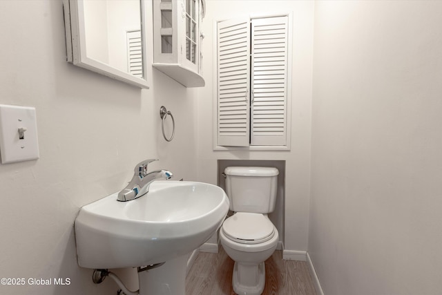 128 Circular St, Saratoga Springs, NY 12866 - bathroom featuring wood finished floors and baseboards