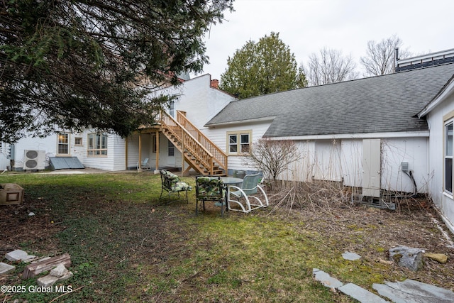 128 Circular St, Saratoga Springs, NY 12866 - rear view of house with stairway, roof with shingles, and a chimney