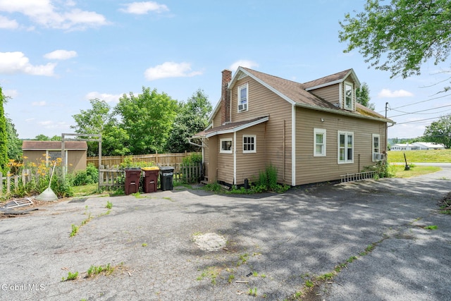 152 Charleston St, Esperance, NY 12066 - view of property exterior with a chimney and cooling unit