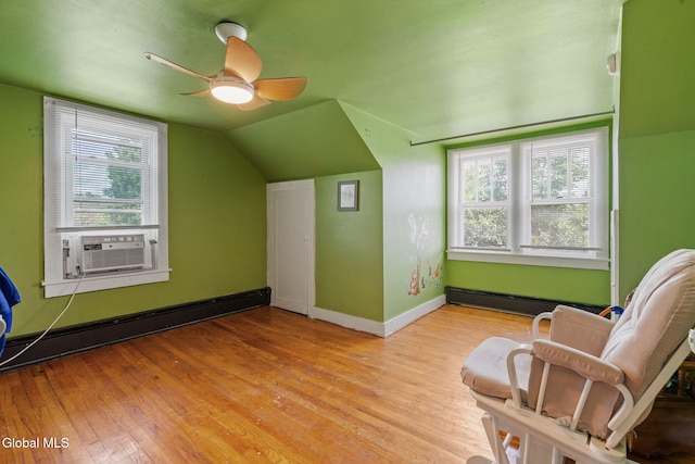152 Charleston St, Esperance, NY 12066 - additional living space featuring a baseboard heating unit, ceiling fan, wood finished floors, cooling unit, and vaulted ceiling