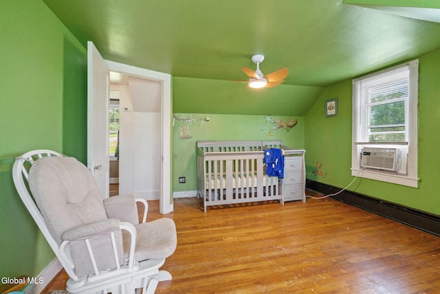 152 Charleston St, Esperance, NY 12066 - bedroom featuring multiple windows, wood finished floors, cooling unit, vaulted ceiling, and a ceiling fan