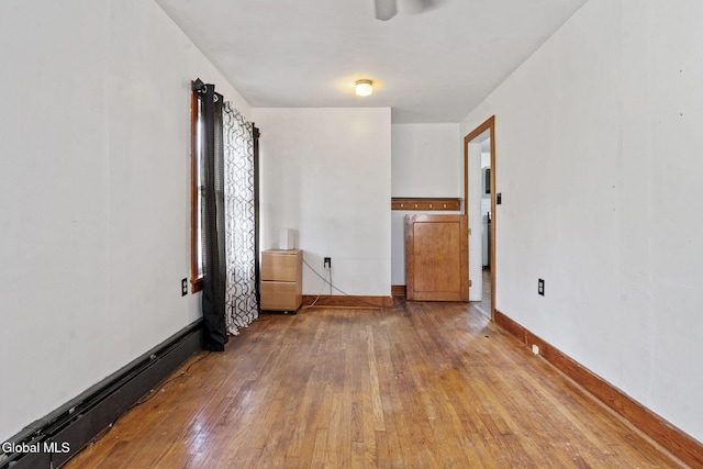 152 Charleston St, Esperance, NY 12066 - unfurnished room with hardwood / wood-style flooring, baseboard heating, and a ceiling fan