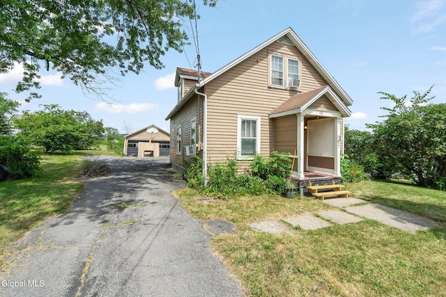 152 Charleston St, Esperance, NY 12066 - bungalow featuring a front yard, an outdoor structure, and cooling unit