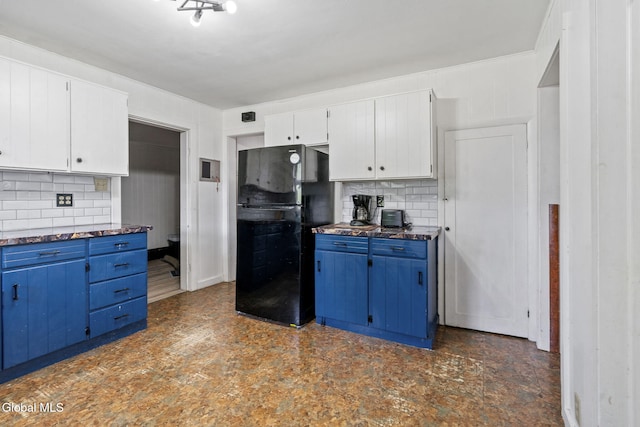 152 Charleston St, Esperance, NY 12066 - kitchen with freestanding refrigerator, blue cabinets, tasteful backsplash, and dark countertops