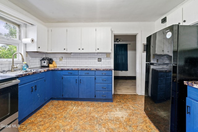 152 Charleston St, Esperance, NY 12066 - kitchen featuring blue cabinets, freestanding refrigerator, backsplash, and white cabinets
