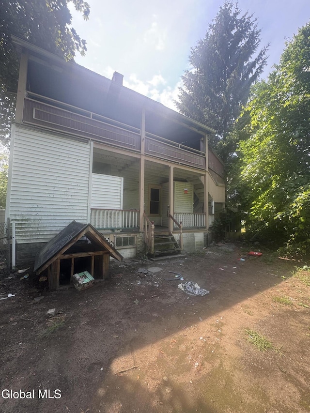 183 Main St, South Glens Falls, NY 12803 - rear view of house featuring a porch and a balcony
