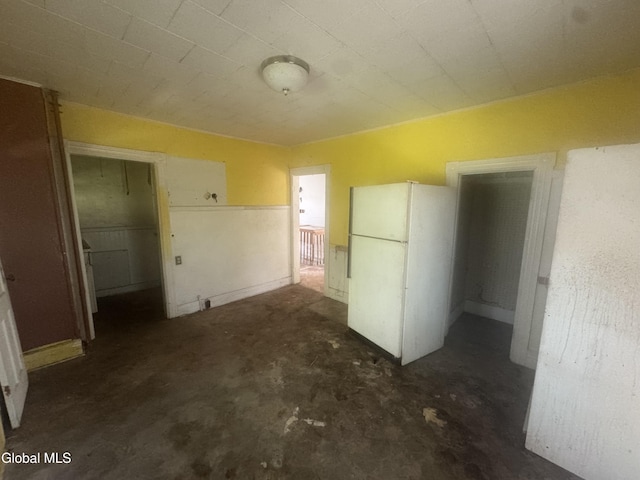 183 Main St, South Glens Falls, NY 12803 - kitchen with freestanding refrigerator and unfinished concrete floors