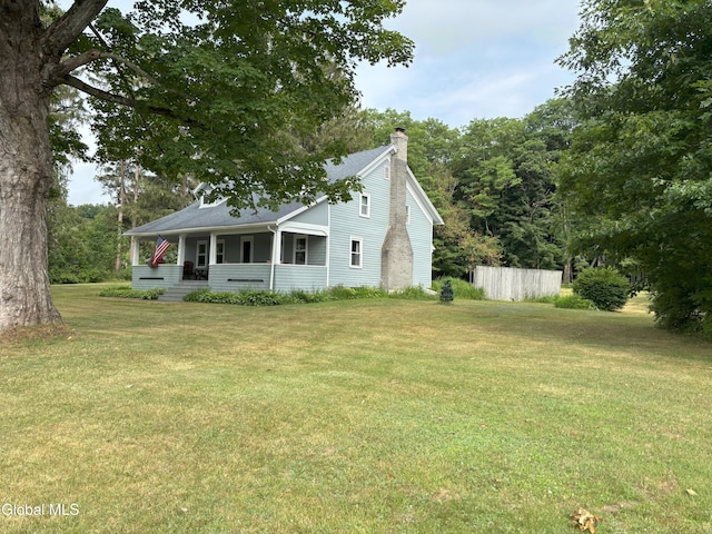 576 County Highway 102, Gloversville, NY 12078 - view of front of property featuring a porch, a chimney, a front lawn, and roof with shingles