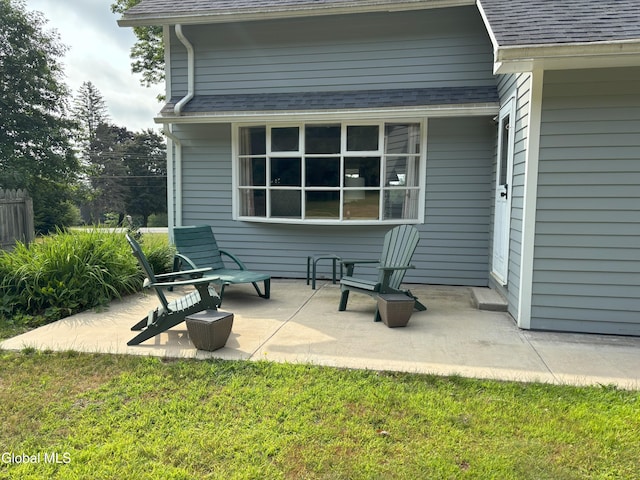 576 County Highway 102, Gloversville, NY 12078 - back of house featuring roof with shingles and a patio area