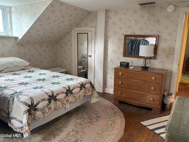 576 County Highway 102, Gloversville, NY 12078 - bedroom featuring dark wood-style flooring, lofted ceiling, and wallpapered walls