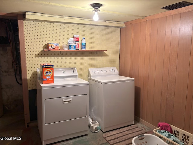 576 County Highway 102, Gloversville, NY 12078 - washroom with washing machine and dryer and wood walls