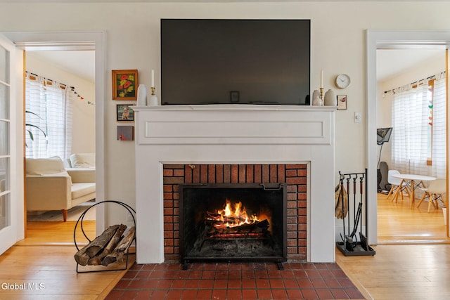 1556 Wendell Ave, Schenectady, NY 12308 - detailed view of a brick fireplace and wood finished floors