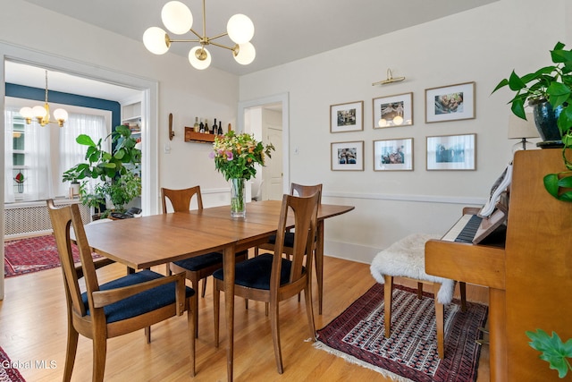 1556 Wendell Ave, Schenectady, NY 12308 - dining space with a chandelier and light wood-style flooring