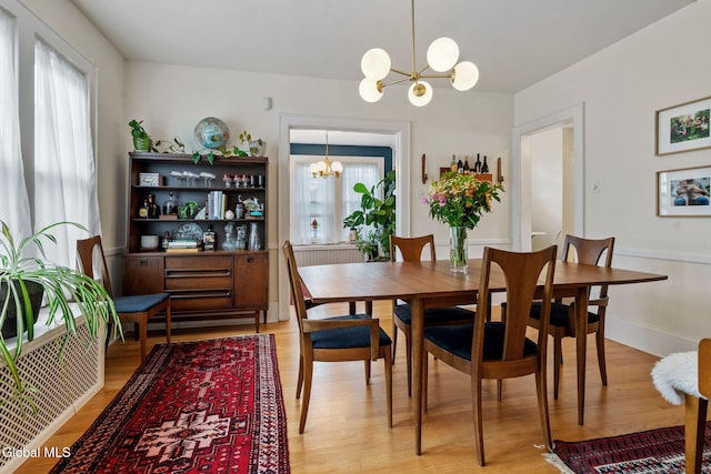 1556 Wendell Ave, Schenectady, NY 12308 - dining space with a chandelier and light wood-type flooring