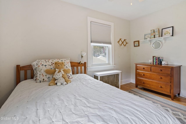 1556 Wendell Ave, Schenectady, NY 12308 - bedroom featuring radiator and wood finished floors