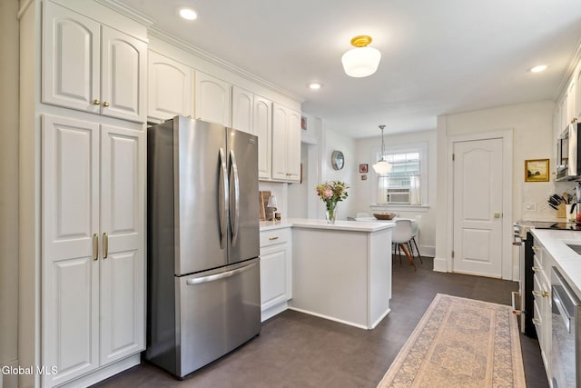 1556 Wendell Ave, Schenectady, NY 12308 - kitchen with stainless steel appliances, light countertops, recessed lighting, pendant lighting, and a peninsula