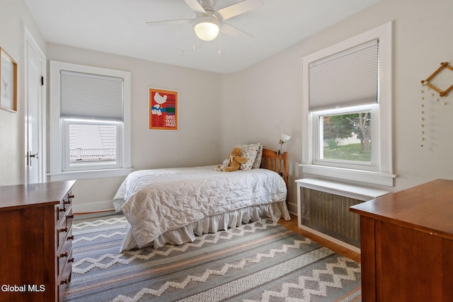 1556 Wendell Ave, Schenectady, NY 12308 - bedroom featuring radiator, wood finished floors, and a ceiling fan