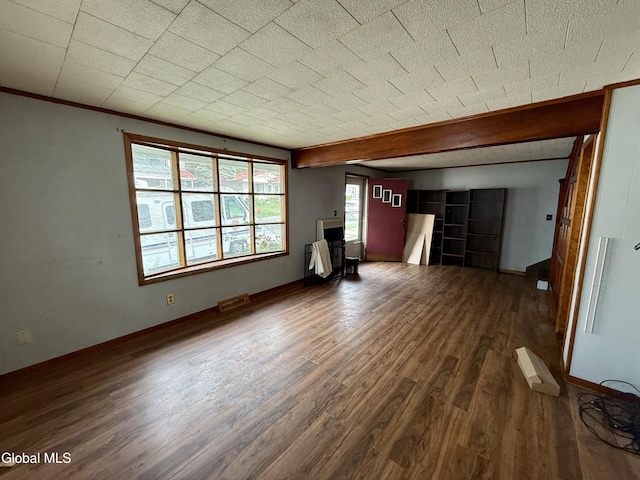 74 Park St, Gloversville, NY 12078 - unfurnished living room with wood finished floors and baseboards