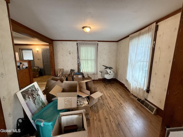 74 Park St, Gloversville, NY 12078 - living area with wood finished floors and crown molding