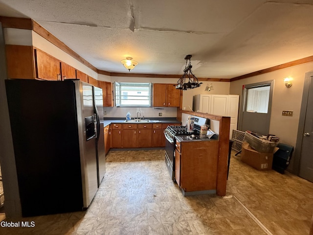 74 Park St, Gloversville, NY 12078 - kitchen featuring stainless steel appliances, brown cabinets, pendant lighting, dark countertops, and decorative backsplash