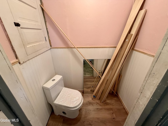 74 Park St, Gloversville, NY 12078 - bathroom featuring a wainscoted wall and wood finished floors
