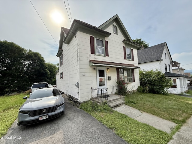 74 Park St, Gloversville, NY 12078 - view of front of home featuring a front yard