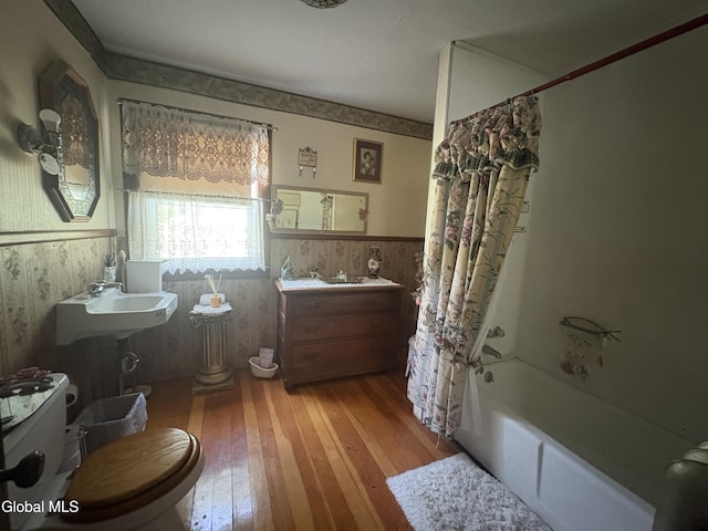 5 Spring St, Port Henry, NY 12974 - full bath with wainscoting, hardwood / wood-style floors, and shower / bath combo