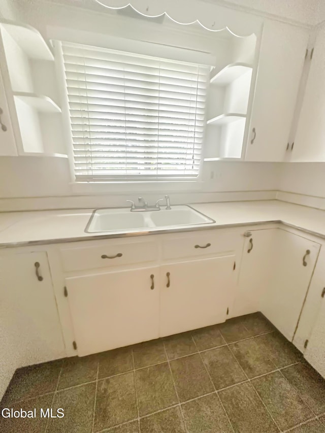32 Abeling St, Canajoharie, NY 13317 - kitchen featuring open shelves, white cabinets, and healthy amount of natural light