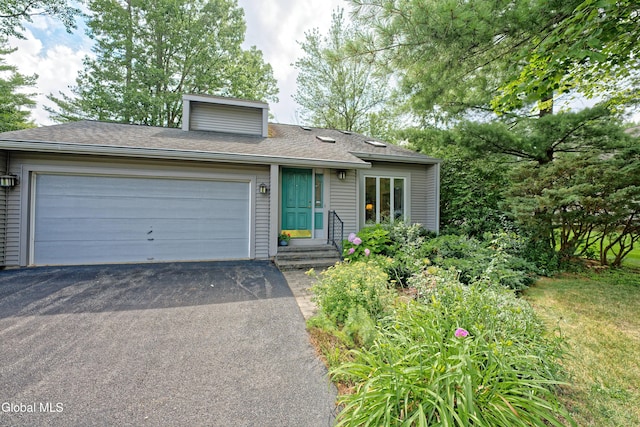 35 Warwick Way, Niskayuna, NY 12309 - view of front of property with driveway, an attached garage, and a shingled roof