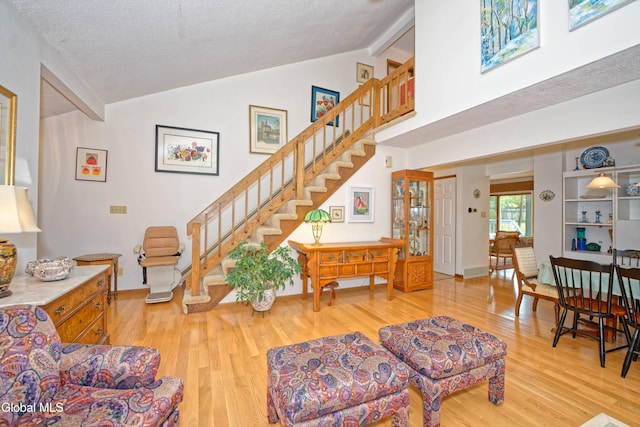 35 Warwick Way, Niskayuna, NY 12309 - living room with light wood-type flooring, stairway, and high vaulted ceiling