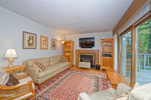 35 Warwick Way, Niskayuna, NY 12309 - living room featuring a textured ceiling, wood finished floors, and a fireplace