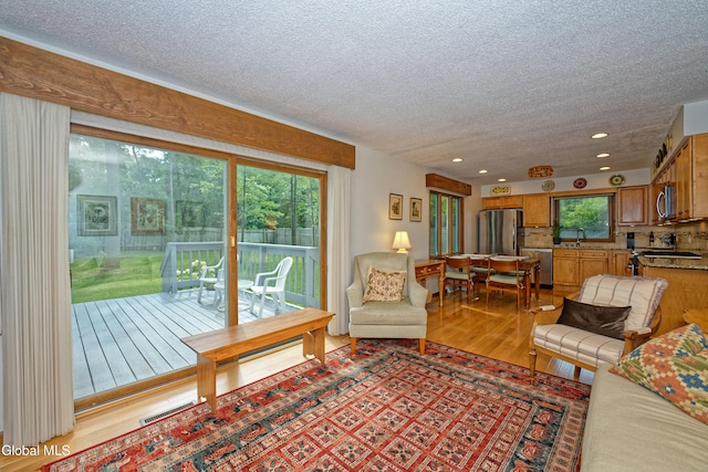 35 Warwick Way, Niskayuna, NY 12309 - living area featuring light wood-style floors, a textured ceiling, and recessed lighting