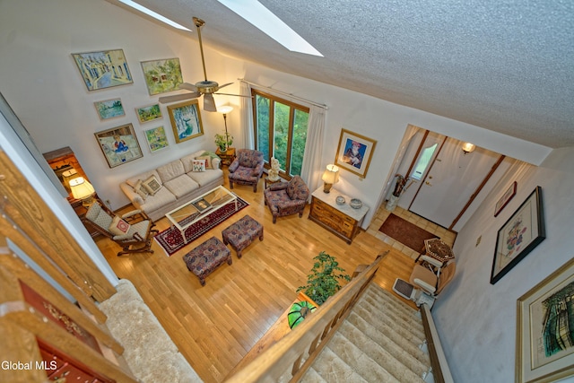 35 Warwick Way, Niskayuna, NY 12309 - living area featuring wood finished floors, a textured ceiling, a skylight, and ceiling fan