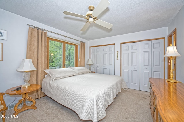 35 Warwick Way, Niskayuna, NY 12309 - bedroom with multiple closets, light carpet, a textured ceiling, and ceiling fan