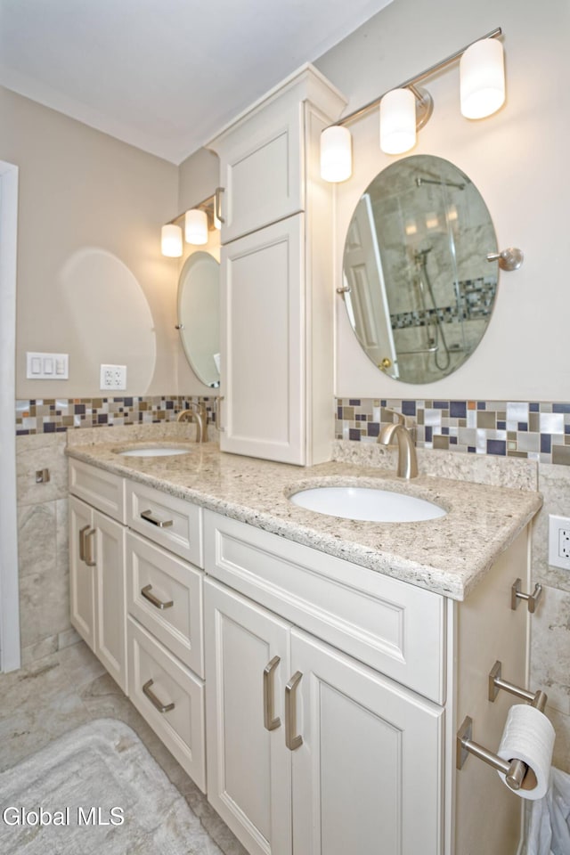 35 Warwick Way, Niskayuna, NY 12309 - full bath featuring tile walls, double vanity, and wainscoting