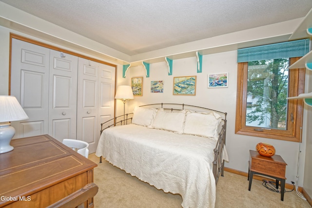 35 Warwick Way, Niskayuna, NY 12309 - bedroom featuring carpet flooring, a closet, and a textured ceiling