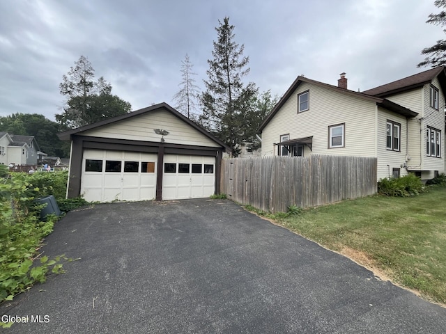 1822 7th St, Rensselaer, NY 12144 - view of side of home featuring a chimney, an outbuilding, and a garage
