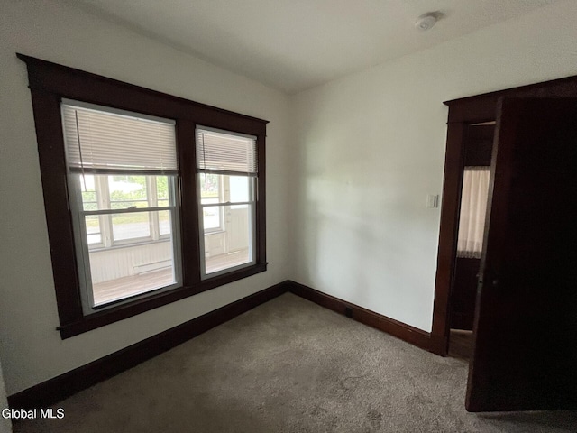 1822 7th St, Rensselaer, NY 12144 - carpeted empty room featuring baseboards