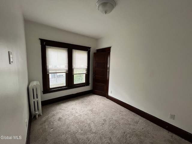 1822 7th St, Rensselaer, NY 12144 - unfurnished room with radiator and carpet