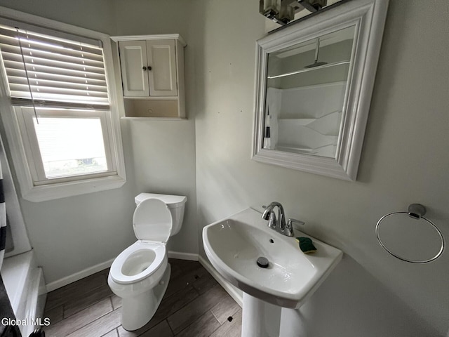 1822 7th St, Rensselaer, NY 12144 - bathroom with toilet and wood finished floors