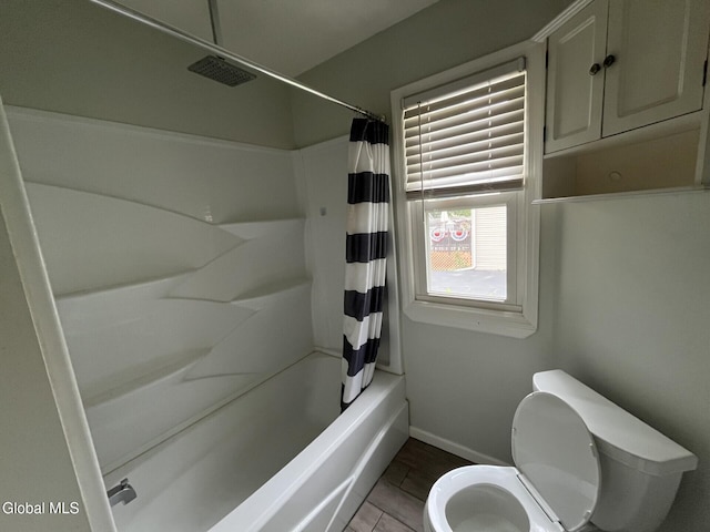 1822 7th St, Rensselaer, NY 12144 - bathroom featuring shower / bath combination with curtain and wood finished floors