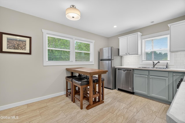 55 Crescent Ave, Saratoga Springs, NY 12866 - kitchen with light countertops, healthy amount of natural light, stainless steel appliances, tasteful backsplash, and recessed lighting