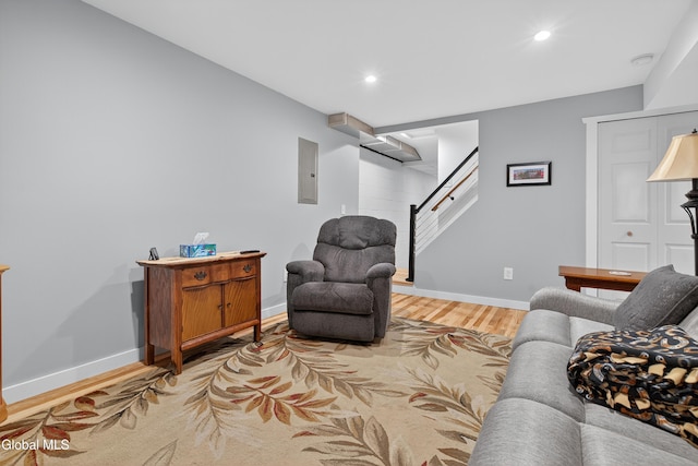 55 Crescent Ave, Saratoga Springs, NY 12866 - living room featuring light wood-style flooring, recessed lighting, stairs, and electric panel